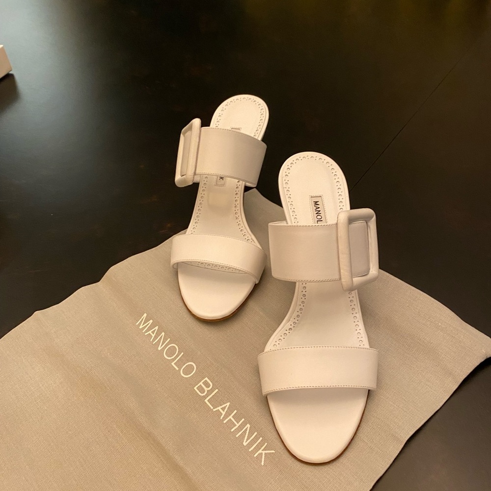 White Manolo Blahnik size 8 mules with buckle.